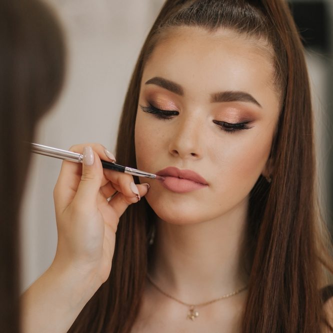 Makeup artist applying makeup